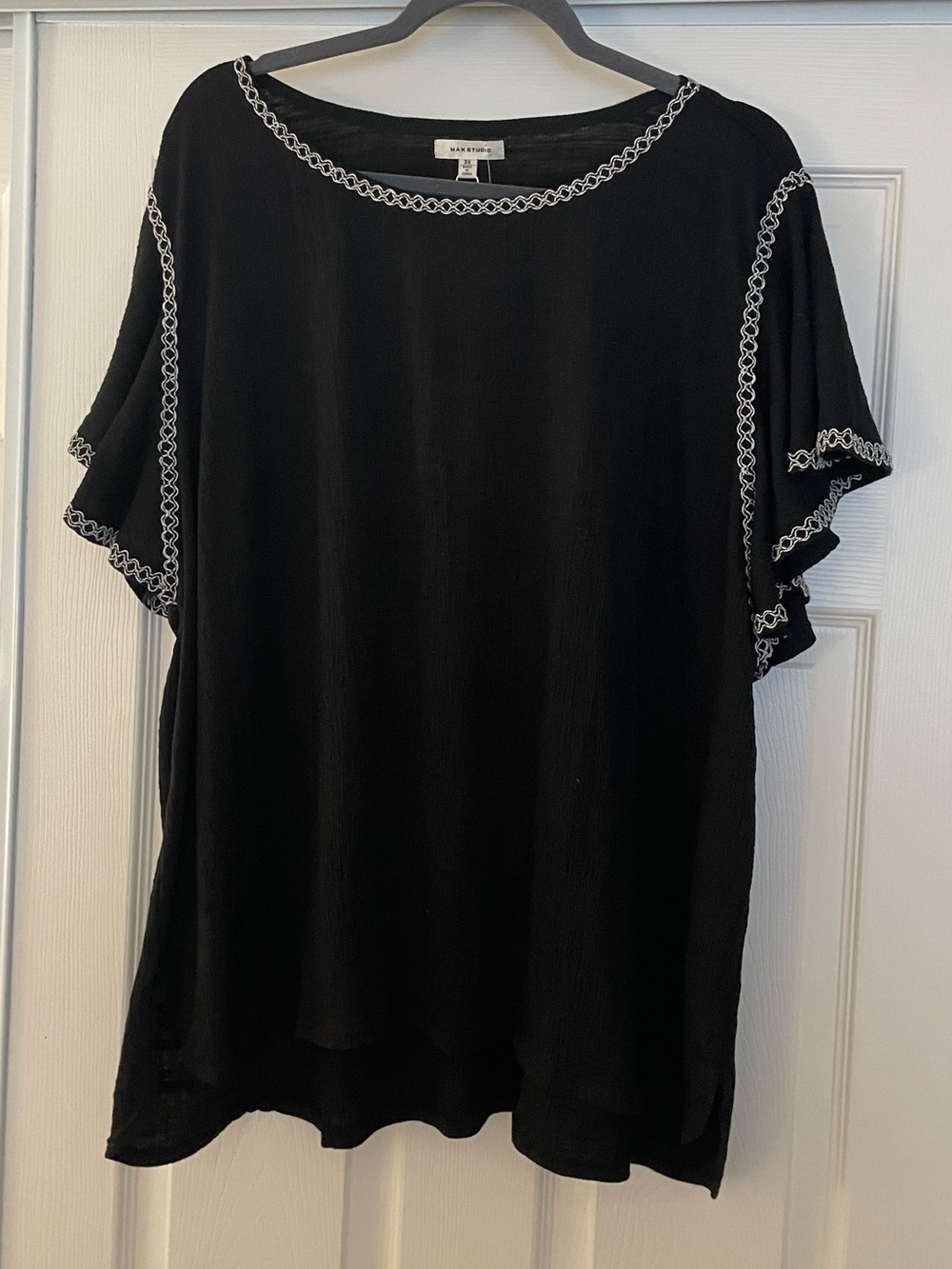 Max Studio Black Top with White Embroidered Trim and flutter sleeves